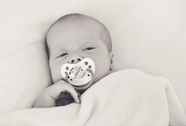 Newborn with dummy — Stock Photo, Image