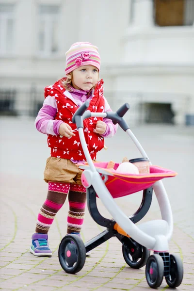 Toddler and stroller — Stock Photo, Image