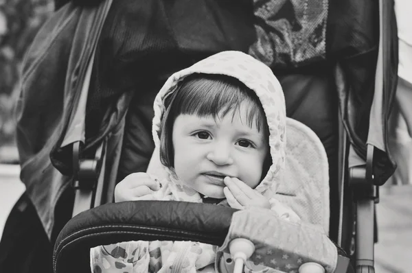 Baby sitting in strolle — Stock Photo, Image