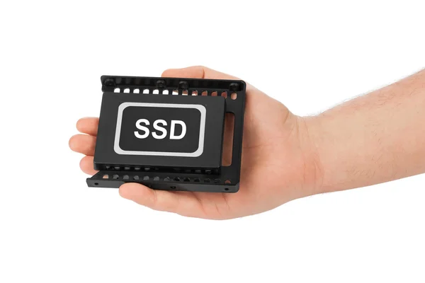 Hand and computer SSD drive — Stock Photo, Image