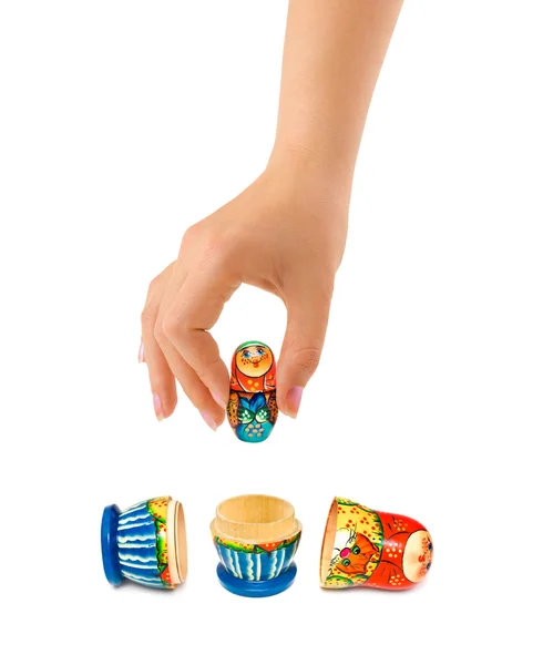 Hand en Russische toy matrioshka — Stockfoto