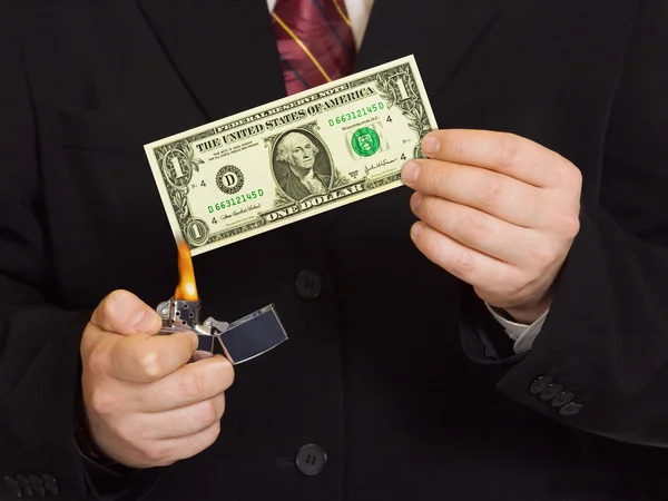 Hands and burnning money — Stock Photo, Image