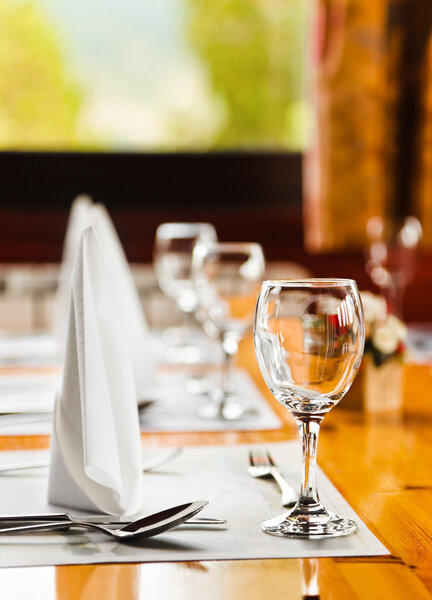 Glasses and plates on table in restaurant