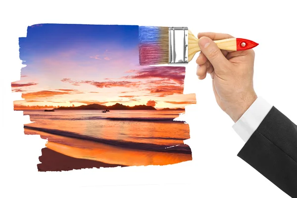 Hand mit Pinsel Malerei Sonnenuntergang — Stockfoto