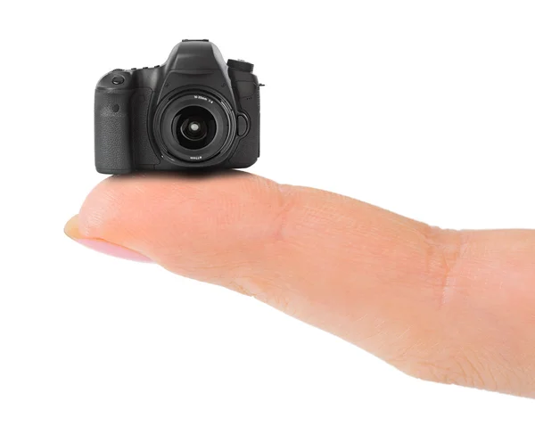 Finger and small camera — Stock Photo, Image