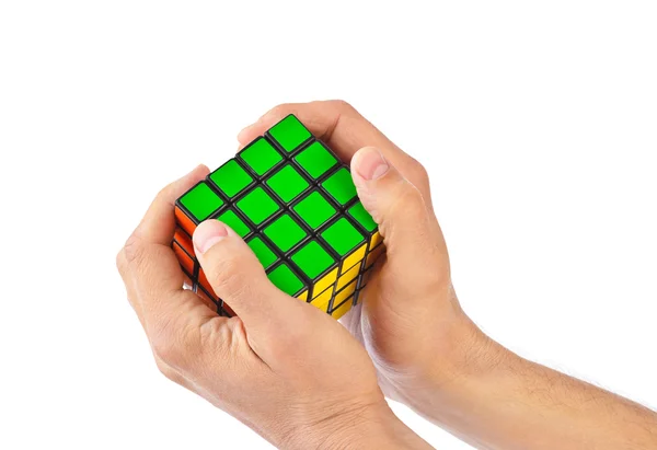 Cube puzzle in hands — Stock Photo, Image