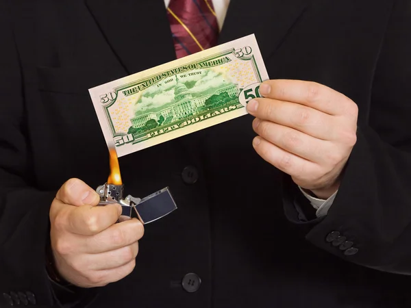 Hands and burnning money — Stock Photo, Image