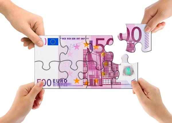 Hände und Geld Puzzle — Stockfoto