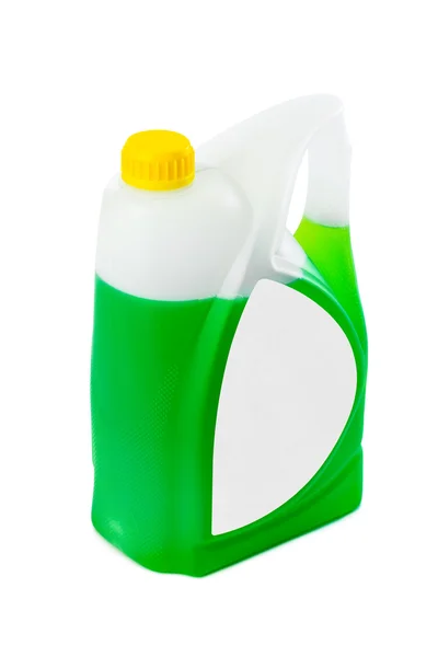 Tanica con liquido verde ed etichetta bianca — Foto Stock