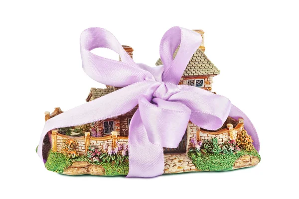 Toy house with bow as gift — Stock Photo, Image