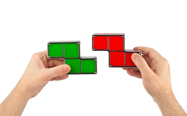 Mains avec des blocs de jouets tetris — Photo