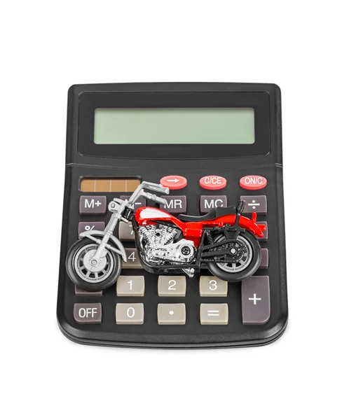 Taschenrechner und Spielzeug-Motorrad — Stockfoto