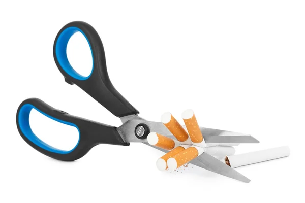 Scissors and cigarettes — Stock Photo, Image