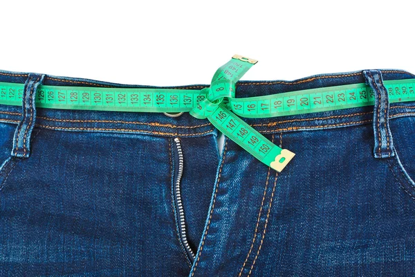 Jeans and measuring tape - slimming concept — Stock Photo, Image