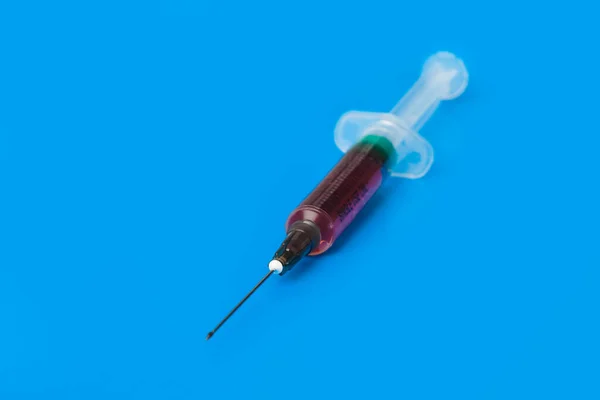 Medical Syringe Blue Background — Stock Photo, Image