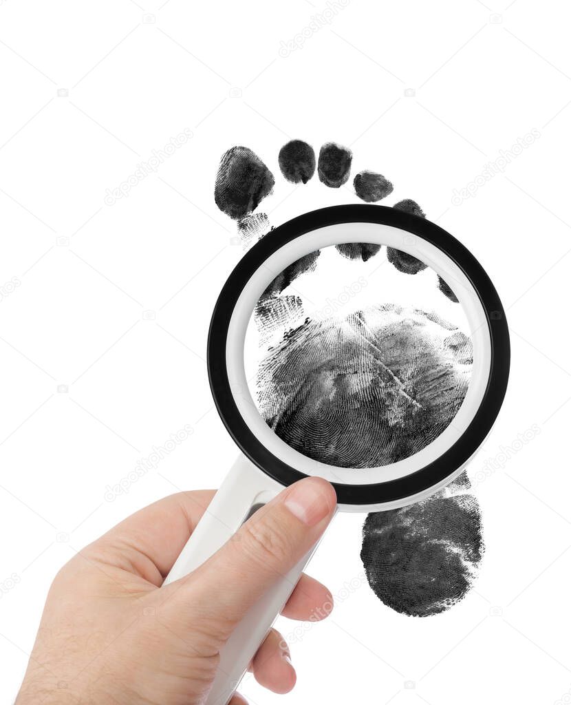 Magnifying glass in hand and foot print isolated on white background