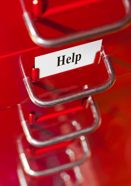 Red file cabinet with card Help — Stock Photo, Image