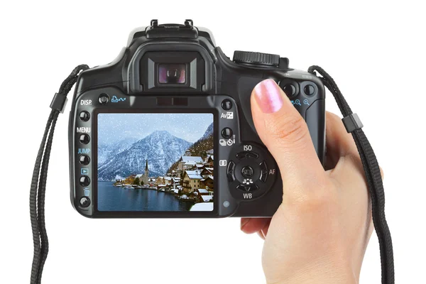 Camera in hand and winter Austria view — Stock Photo, Image