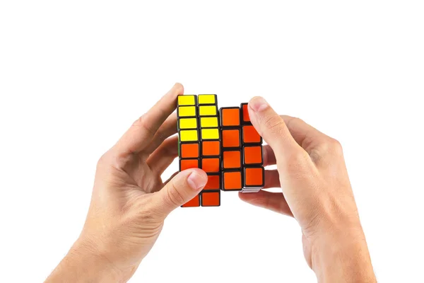 Cube puzzle in hands — Stock Photo, Image