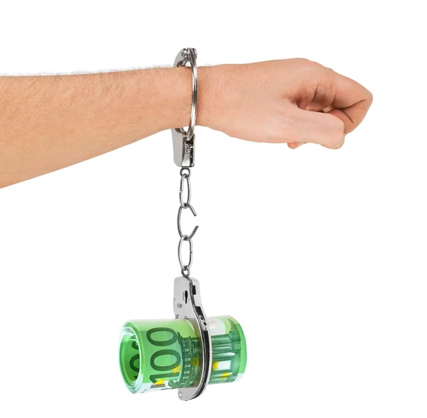 Hand with breaking handcuffs and money — Stock Photo, Image