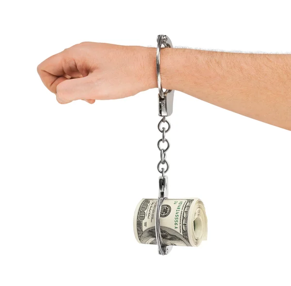 Hand with handcuffs and money — Stock Photo, Image