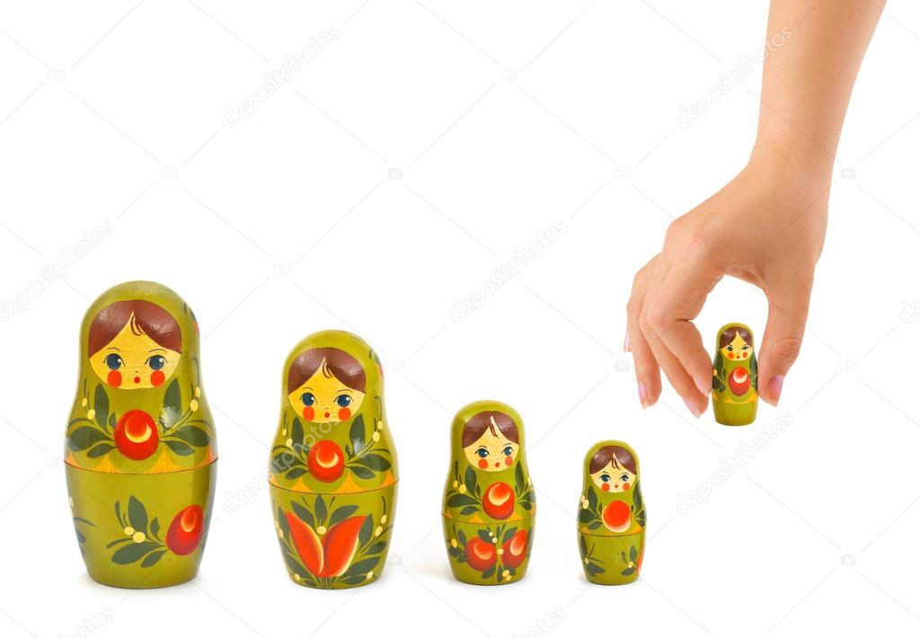 Hand and russian toy matrioska