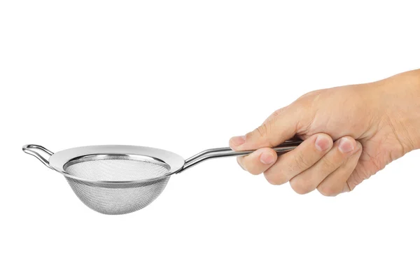 Metal strainer in hand — Stock Photo, Image