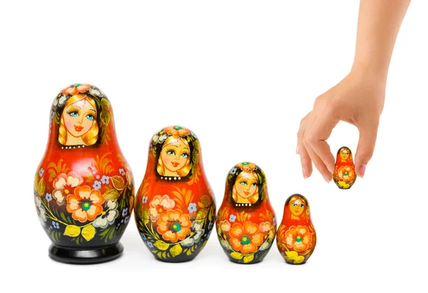 Hand and russian toy matrioska — Stock Photo, Image