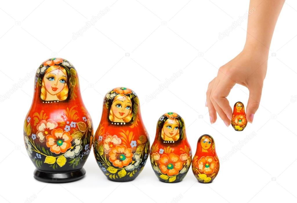 Hand and russian toy matrioska