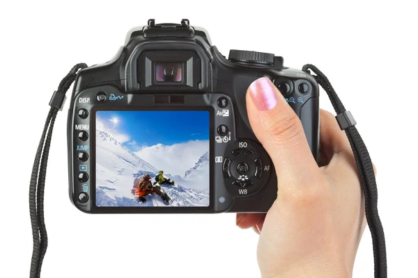 Camera in hand and winter Austria view — Stock Photo, Image