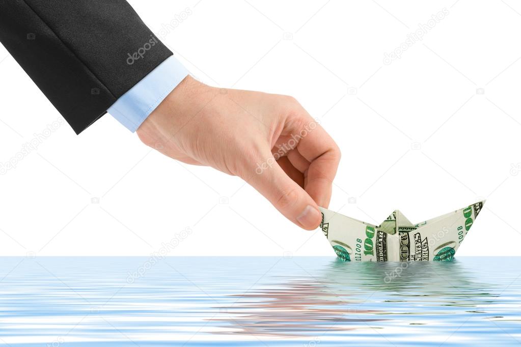 Hand launching money ship
