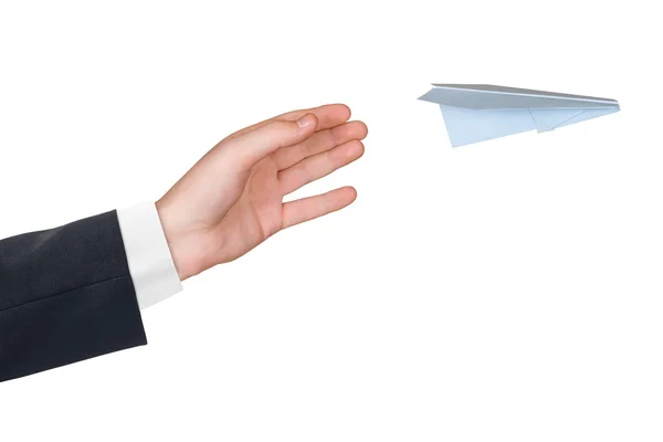 Hand and flying paper plane — Stock Photo, Image