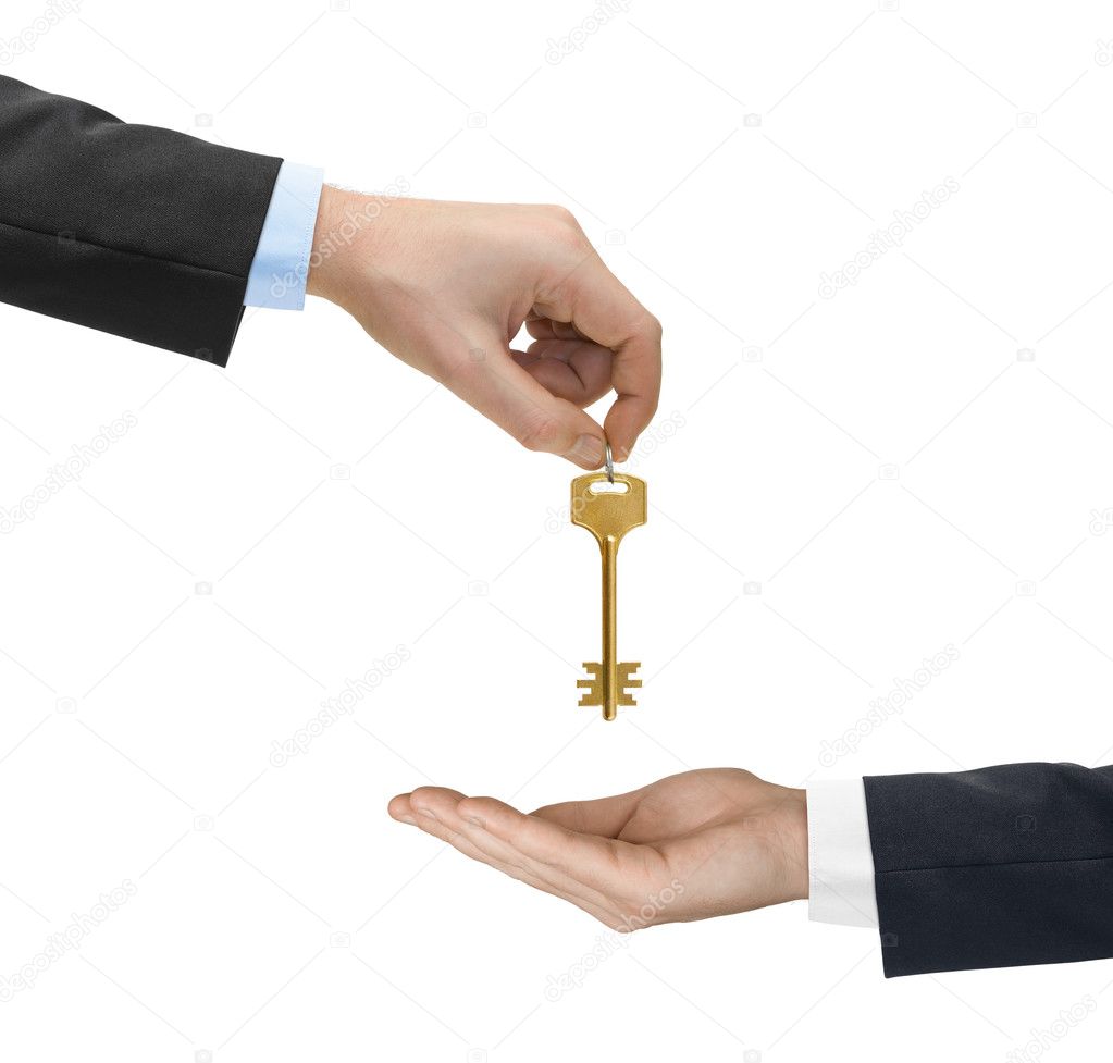 Hands and golden key