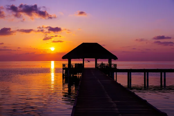 Water cafe at sunset - Maldives — Stock Photo, Image