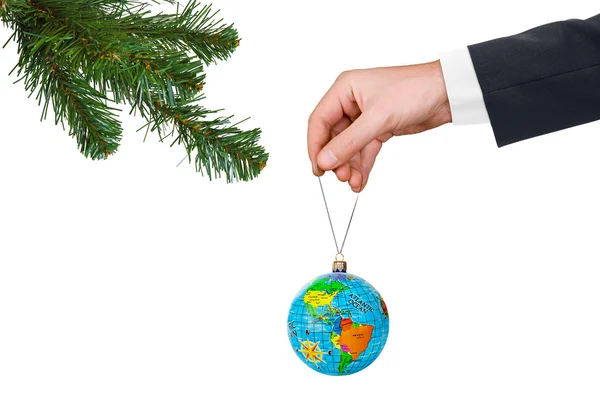 Hand with earth and Christmas tree — Stock Photo, Image