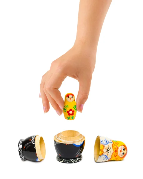 Hand and russian toy matrioska — Stock Photo, Image