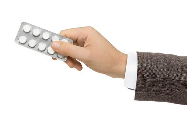 Hand giving pills — Stock Photo, Image
