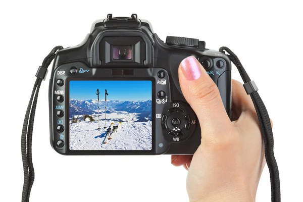 Camera in hand and winter Austria view — Stock Photo, Image
