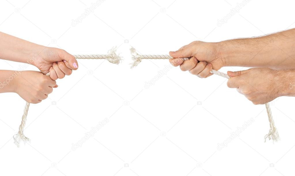 Man and woman hands with breaking rope