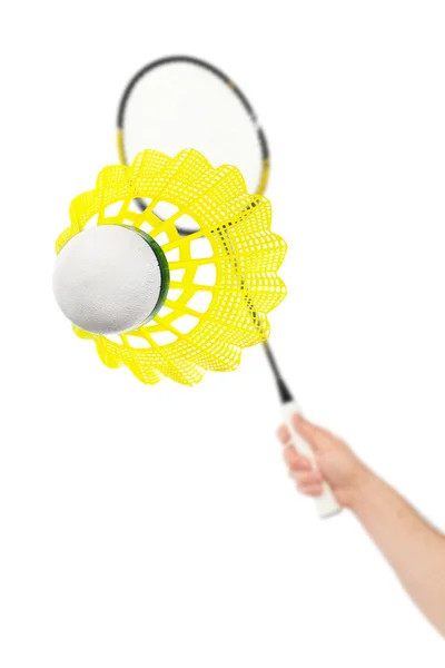 Hand with badminton racket and shuttlecock — Stock Photo, Image
