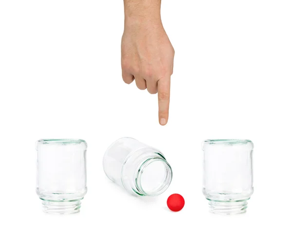 手とガラスの瓶のシェル ゲーム — ストック写真