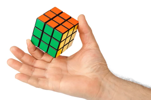 Куб головоломка в руке — стоковое фото