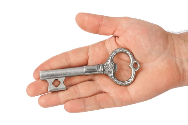 Hand with retro silver key — Stock Photo, Image