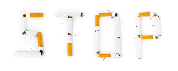 Word Stop made of broken cigarettes — Stock Photo, Image