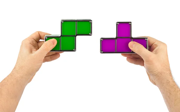 Mãos com blocos de brinquedo tetris — Fotografia de Stock