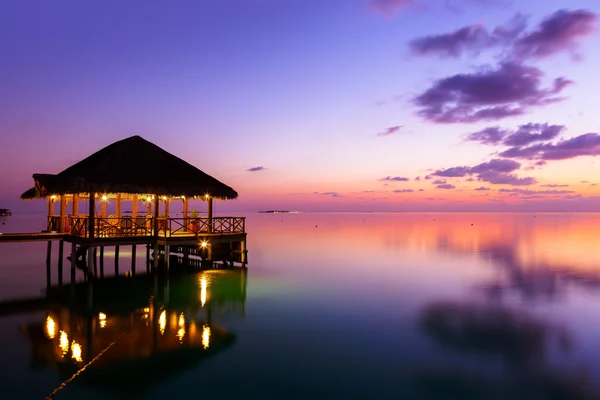 Water cafe at sunset - Maldives — Stock Photo, Image