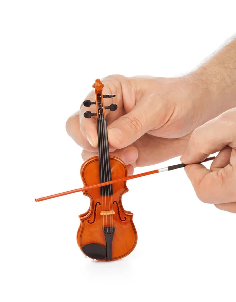 Händer och leksak violin — Stockfoto