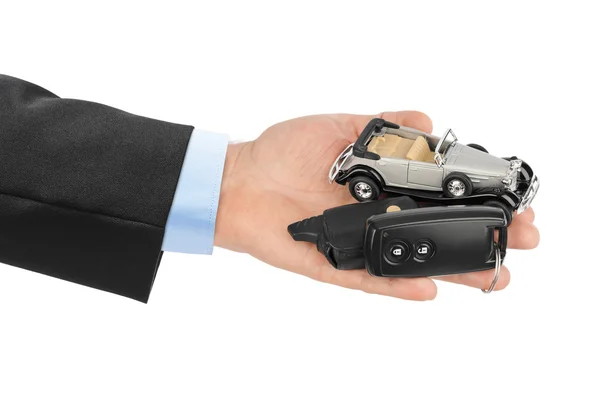 Hand with keys and car — Stock Photo, Image