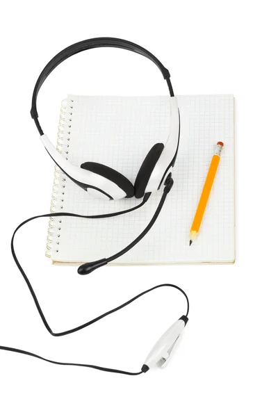 Headphones and notepad — Stock Photo, Image