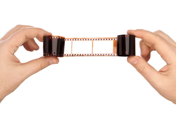 Photographic film in hands — Stock Photo, Image